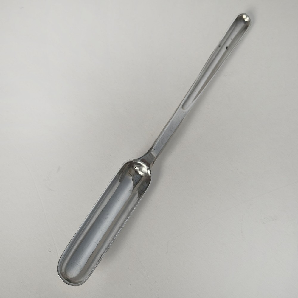 A nineteenth-century sterling silver marrow scoop crafted by Jonathan Hayne in 1833, displayed against a neutral surface.