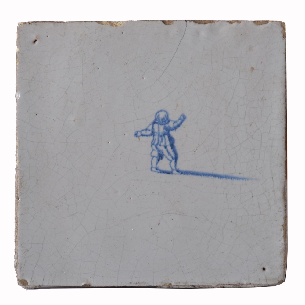 Square 18th century tin-glazed earthenware tile with hand-painted cobalt blue figure on an off-white surface. View III