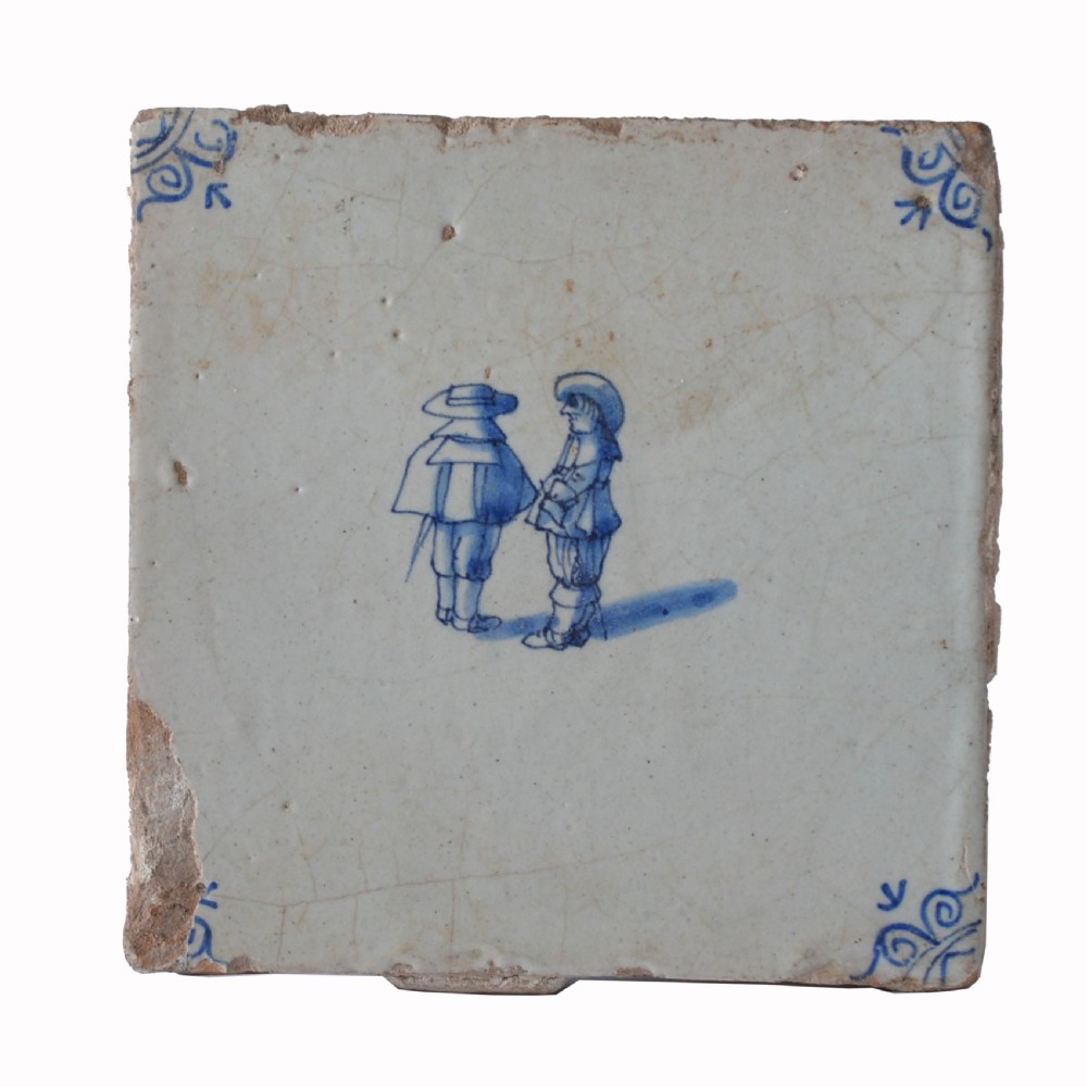A square 18th-century Dutch Delft tile featuring hand-painted figures in cobalt blue on a crazed off-white tin-glazed earthenware surface with corner embellishments. View III