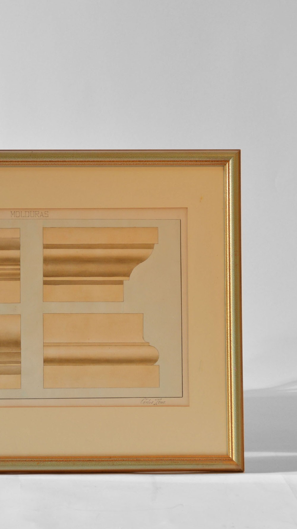 A framed architectural watercolour drawing displaying four technical cross-section profiles of classic building mouldings on a beige mount with a slim gilt frame. View II