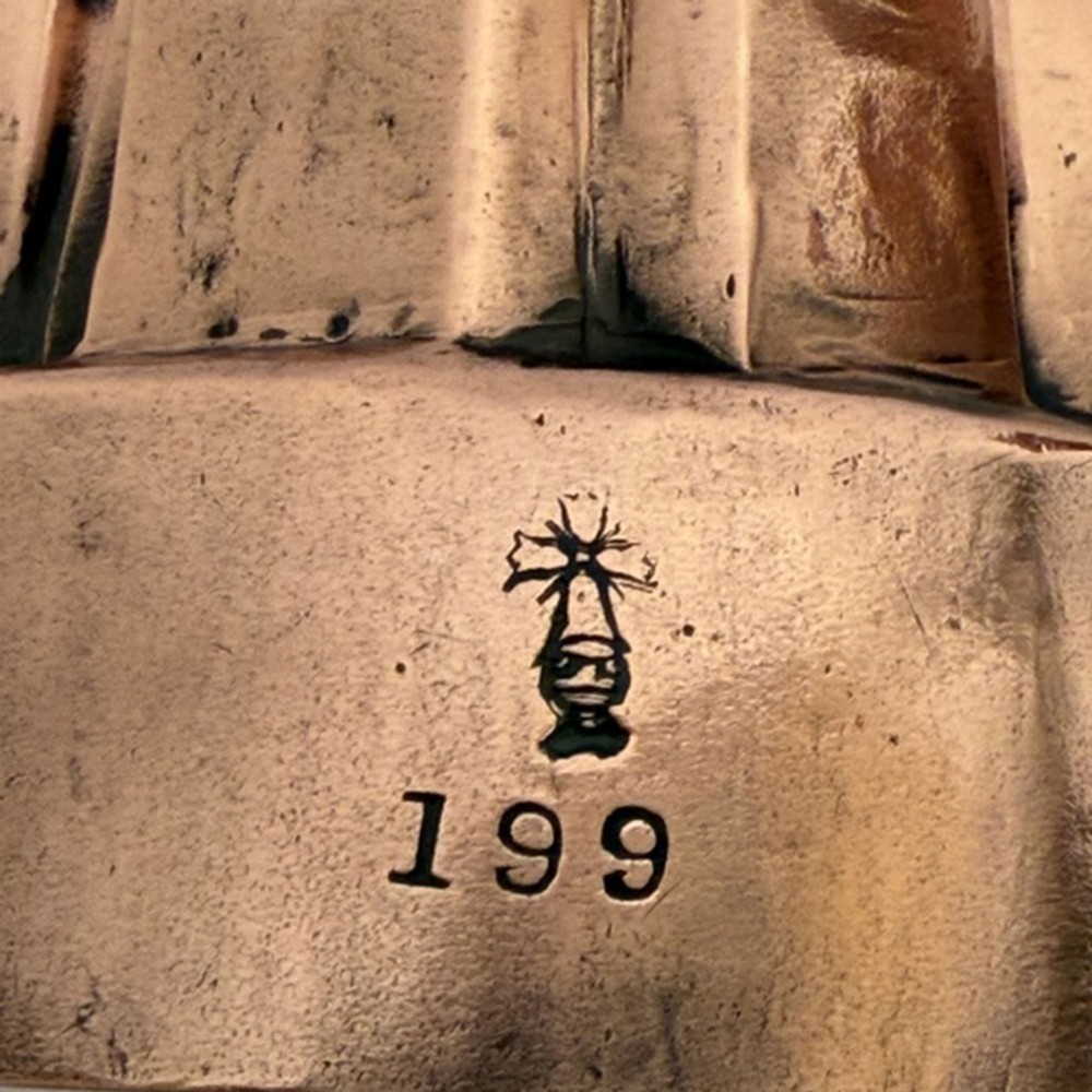 A nineteenth-century copper jelly mould featuring an oval base and architectural turret-shaped spires with pyramidal caps. View IV