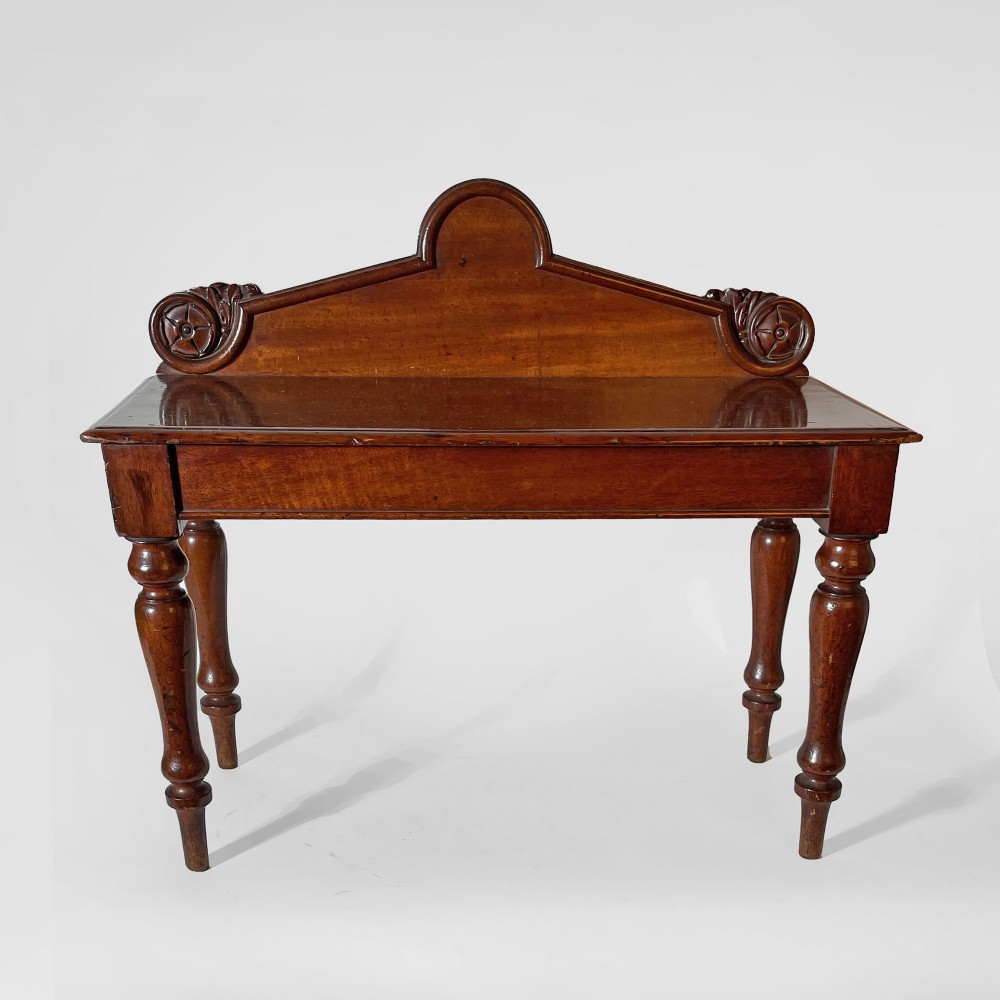 A mahogany scale model of a serving table featuring turned legs and a carved backboard crest. View III