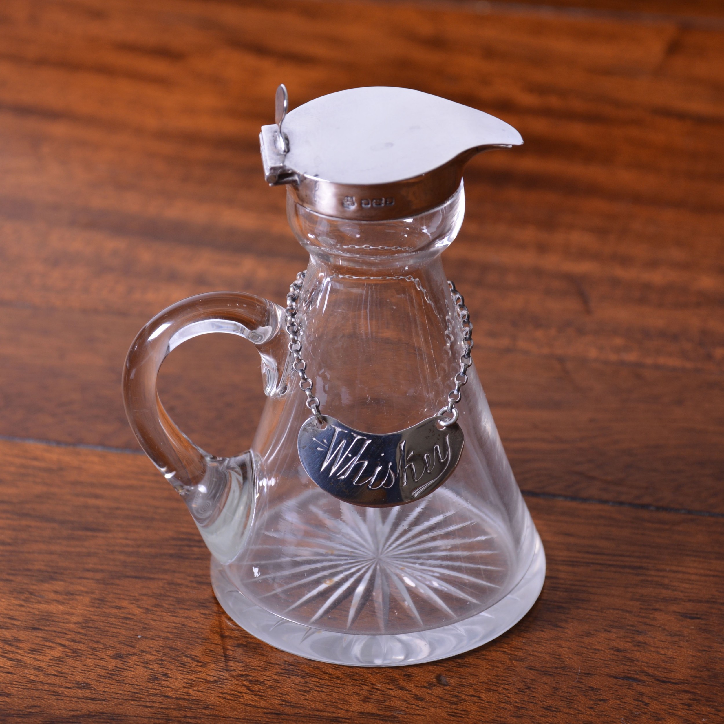 A Silver Mounted Toddy Decanter And 