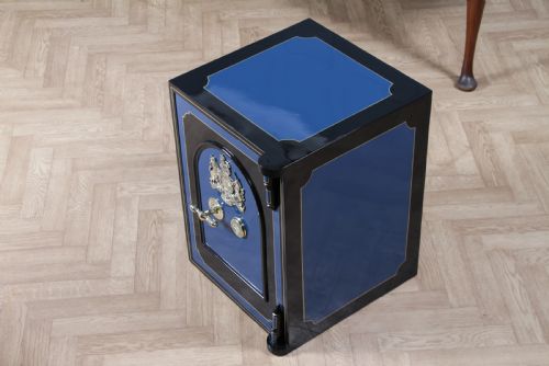 fig 2. A heavy restored Victorian cast iron safe featuring a deep blue and black lacquered exterior with gold pinstriping and a brass royal coat of arms crest.