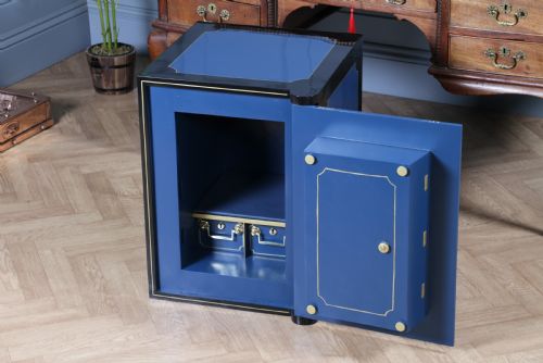 fig 5. A heavy restored Victorian cast iron safe featuring a deep blue and black lacquered exterior with gold pinstriping and a brass royal coat of arms crest.