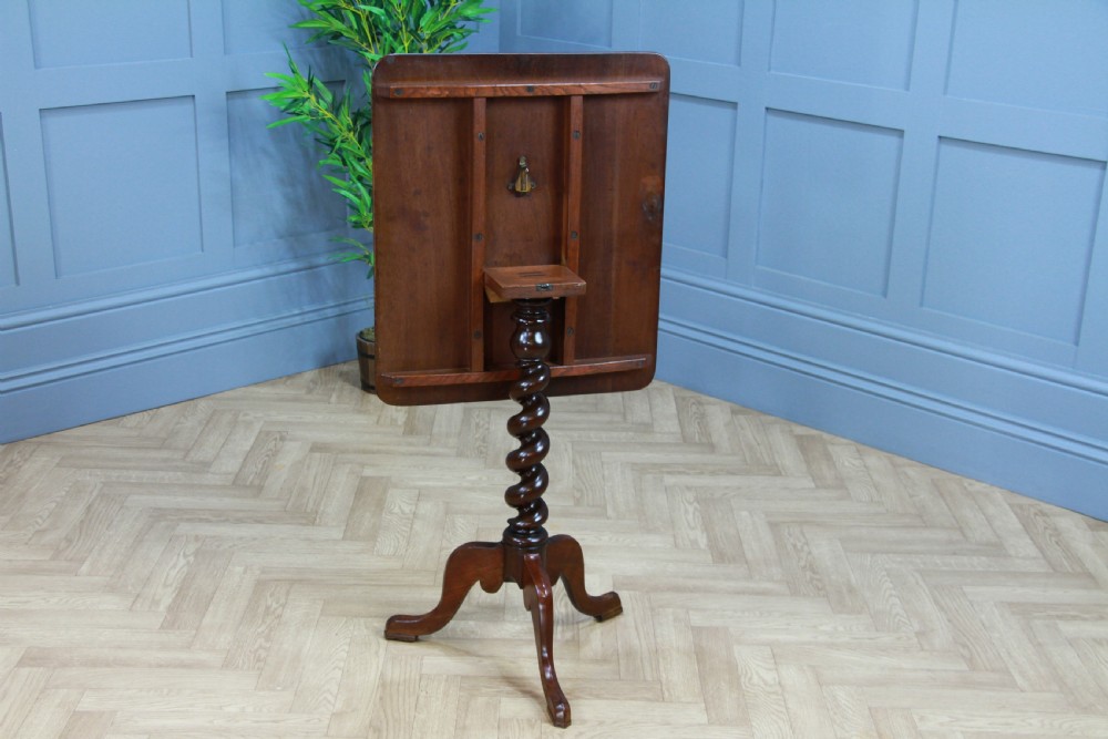 A Victorian flame mahogany tilt-top wine table with a rectangular top, spiral barley twist column, and tripod base. View III