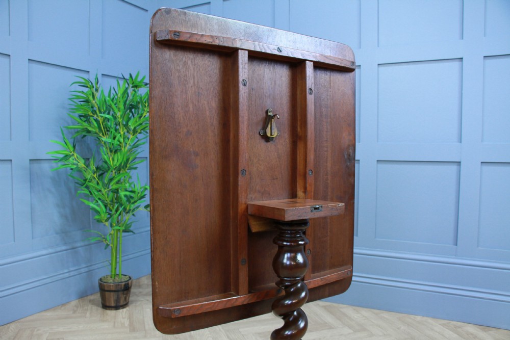 A Victorian flame mahogany tilt-top wine table with a rectangular top, spiral barley twist column, and tripod base. View VIII