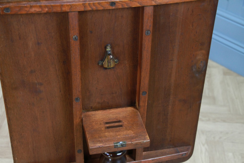 A Victorian flame mahogany tilt-top wine table with a rectangular top, spiral barley twist column, and tripod base. View IX