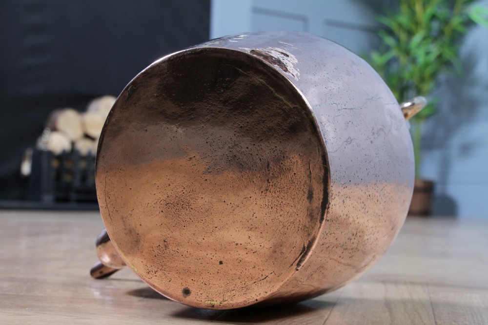 A polished George III copper kettle with a raised brass fixed handle and a curved gooseneck spout. View VI