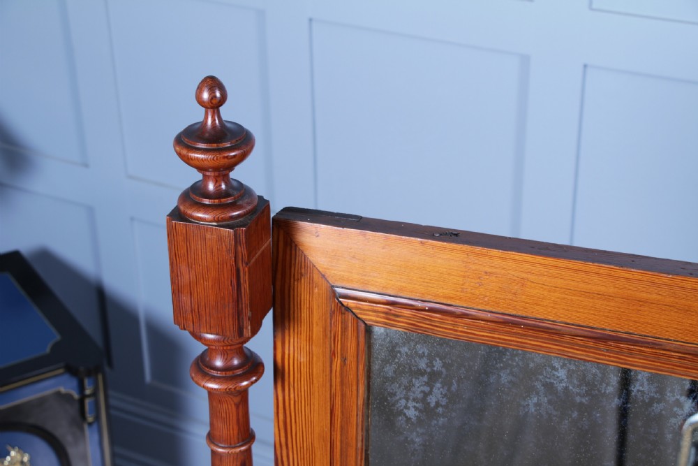 Victorian pitch pine cheval mirror featuring turned upright pillars, decorative finials, and a large tilting glass plate. View VIII