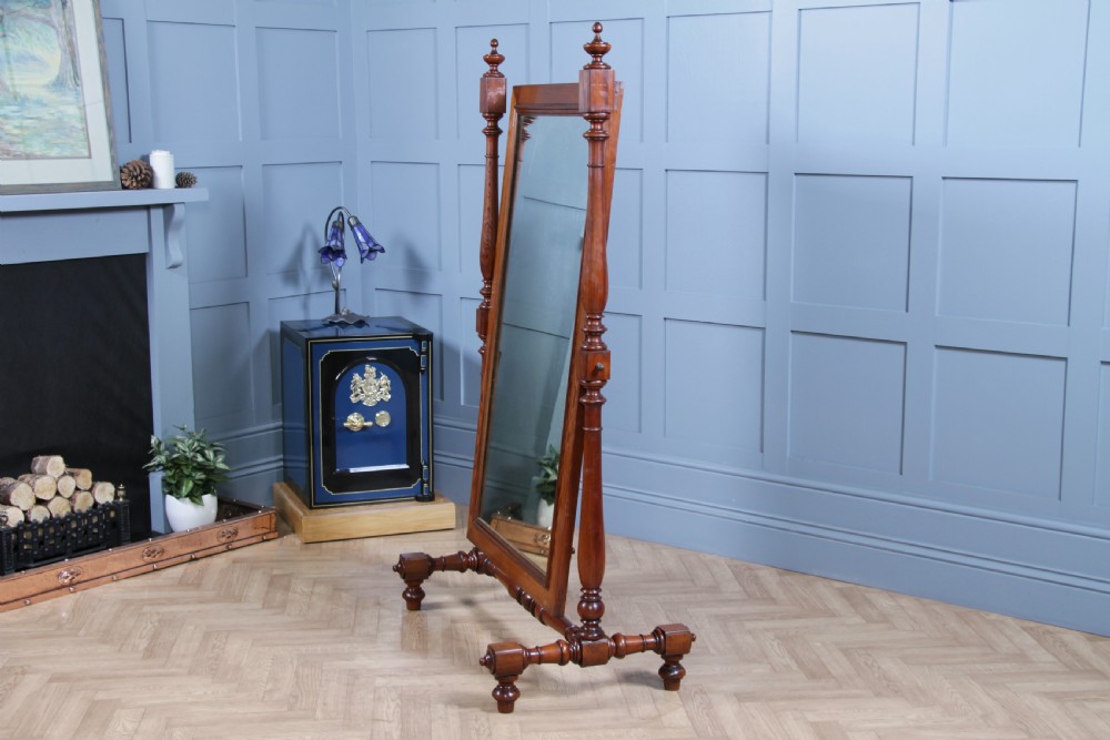 Victorian pitch pine cheval mirror featuring turned upright pillars, decorative finials, and a large tilting glass plate. View XI