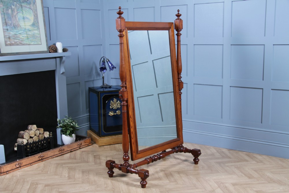 Victorian pitch pine cheval mirror featuring turned upright pillars, decorative finials, and a large tilting glass plate. View XIII