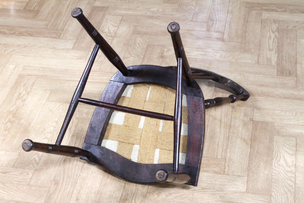 An Edwardian dark walnut nursing chair featuring a spindled stick back, turned legs, and a patterned yellow fabric seat. View XIII