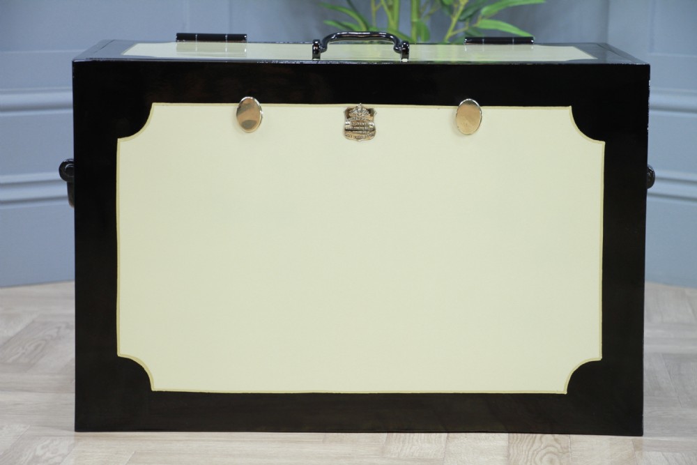A restored Victorian George Price iron strong box with black painted edges, cream center panels, heavy iron handles, and a brass makers plaque. View III