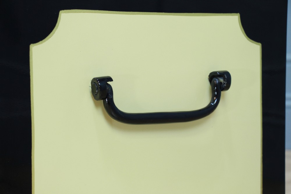 A restored Victorian George Price iron strong box with black painted edges, cream center panels, heavy iron handles, and a brass makers plaque. View VIII