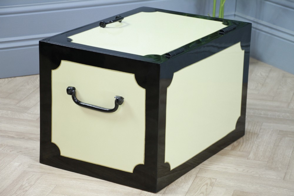 A restored Victorian George Price iron strong box with black painted edges, cream center panels, heavy iron handles, and a brass makers plaque. View XII