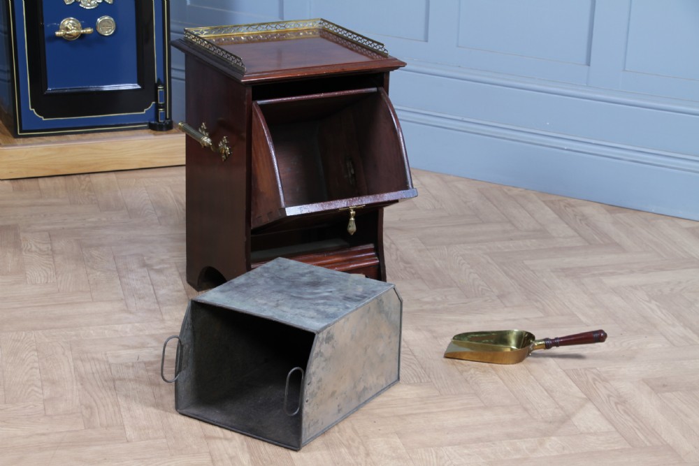 An Edwardian dark mahogany coal purdonium featuring classical floral marquetry inlay, side carry handles, a pierced brass top gallery, and a rear wooden shovel handle. View III