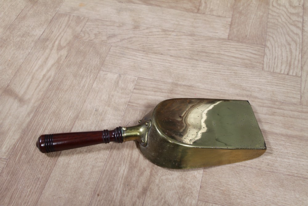 An Edwardian dark mahogany coal purdonium featuring classical floral marquetry inlay, side carry handles, a pierced brass top gallery, and a rear wooden shovel handle. View XVIII