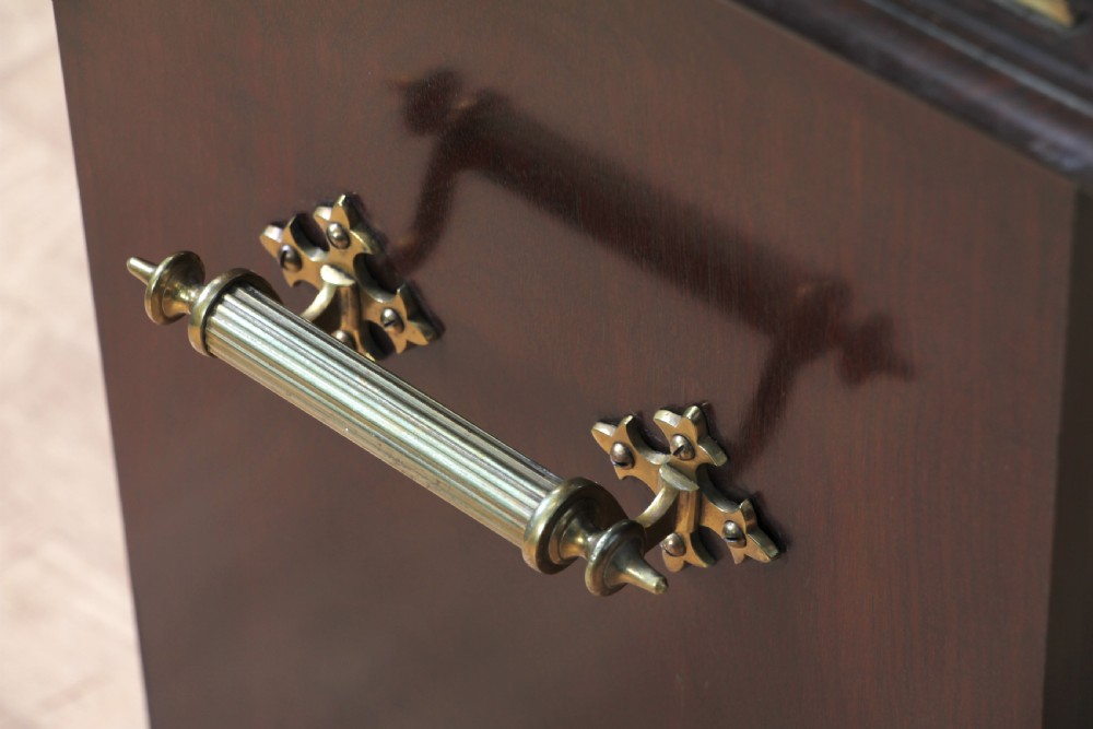 An Edwardian dark mahogany coal purdonium featuring classical floral marquetry inlay, side carry handles, a pierced brass top gallery, and a rear wooden shovel handle. View XX