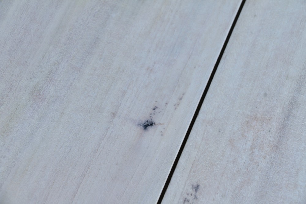 A restored Victorian Pembroke table featuring a bleached mahogany drop-leaf top and a black painted frame with turned legs on brass castors. View XXII