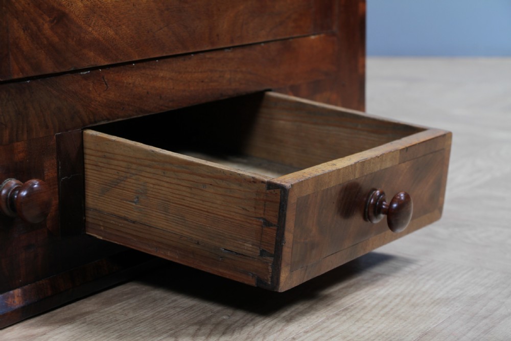A Georgian mahogany wall-hanging corner cabinet featuring a single door with geometric glazed panels and a small base drawer. View X