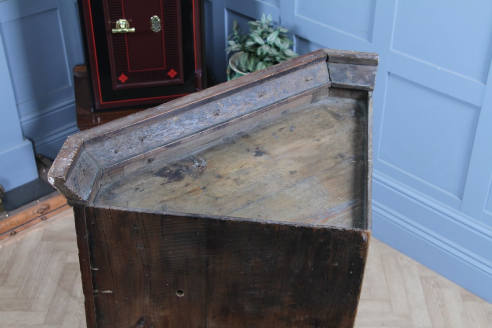 A Georgian mahogany wall-hanging corner cabinet featuring a single door with geometric glazed panels and a small base drawer. View XIX