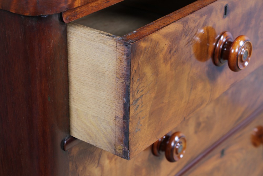 Outstanding Original Antique Victorian Flame Grain Mahogany Chest of 5 Drawers on Turned Legs View X