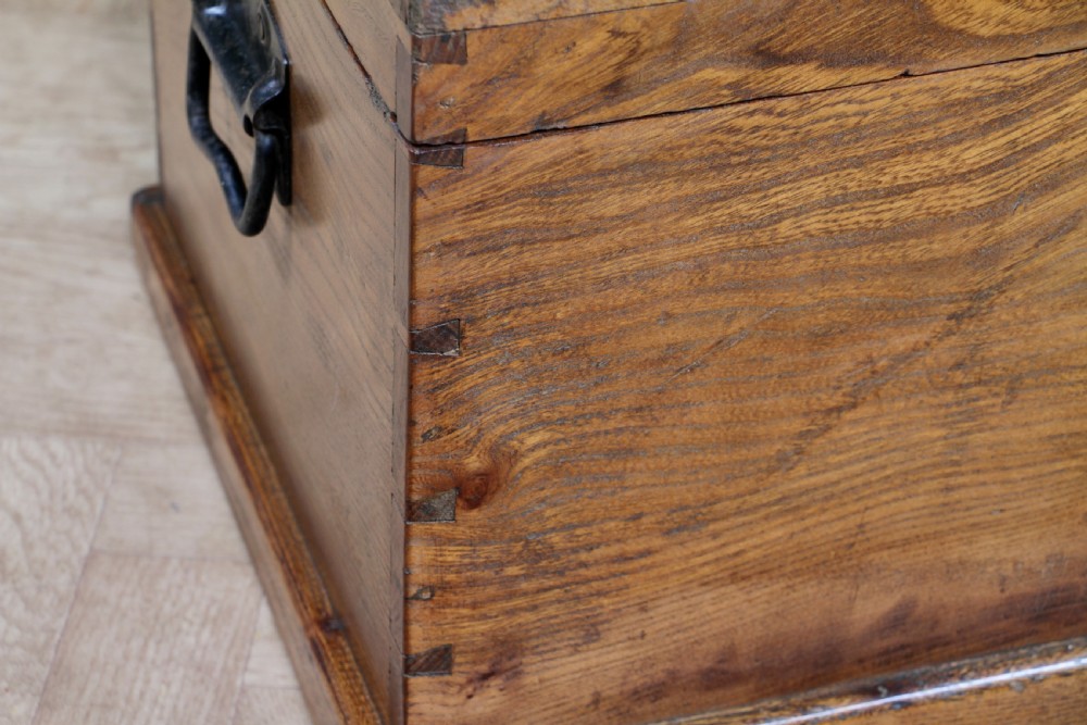A rectangular solid elm tool chest featuring hand-cut dovetail joints, black iron side handles, and a warm wood grain finish. View XIV