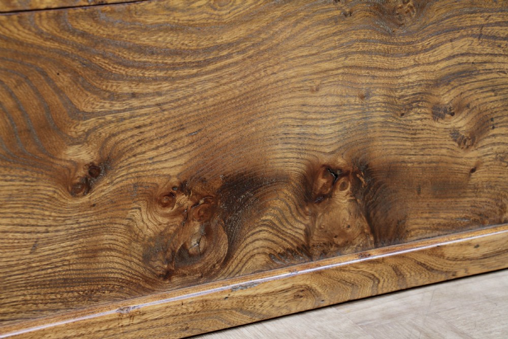 A rectangular solid elm tool chest featuring hand-cut dovetail joints, black iron side handles, and a warm wood grain finish. View XVII