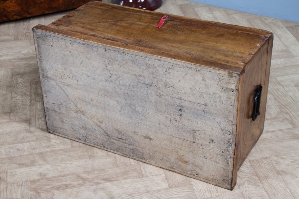 A rectangular solid elm tool chest featuring hand-cut dovetail joints, black iron side handles, and a warm wood grain finish. View XXII