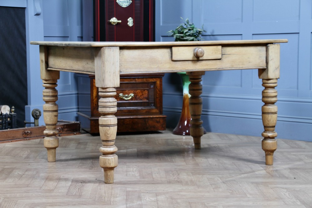 A restored Victorian pine kitchen table featuring a scrubbed rectangular plank top, a single frieze drawer with a wooden knob, and four turned legs. View II