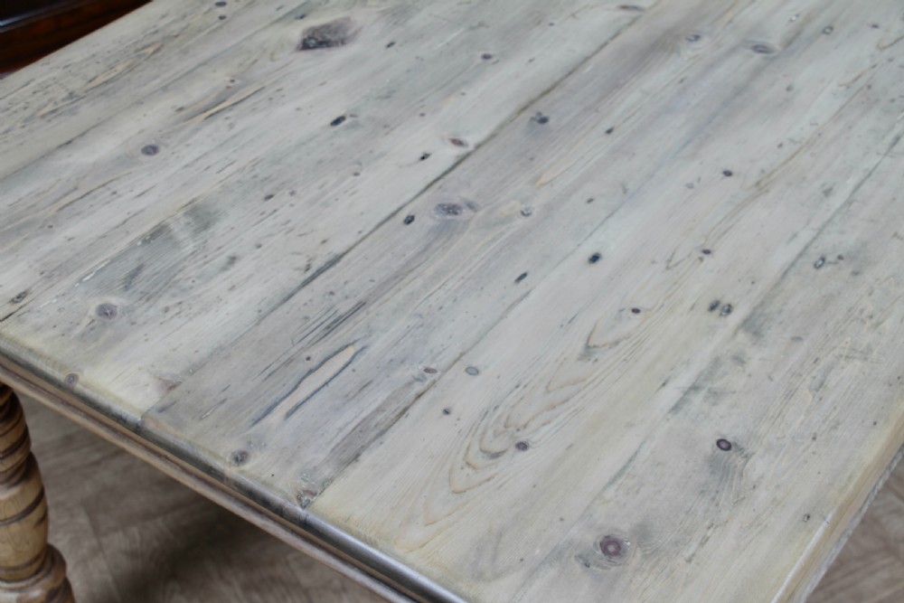 A restored Victorian pine kitchen table featuring a scrubbed rectangular plank top, a single frieze drawer with a wooden knob, and four turned legs. View VII