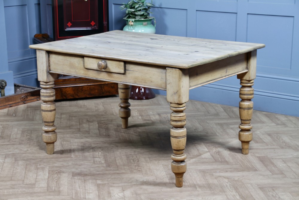 A restored Victorian pine kitchen table featuring a scrubbed rectangular plank top, a single frieze drawer with a wooden knob, and four turned legs. View XI