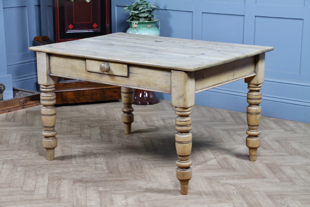 A restored Victorian pine kitchen table featuring a scrubbed rectangular plank top, a single frieze drawer with a wooden knob, and four turned legs. View XVII