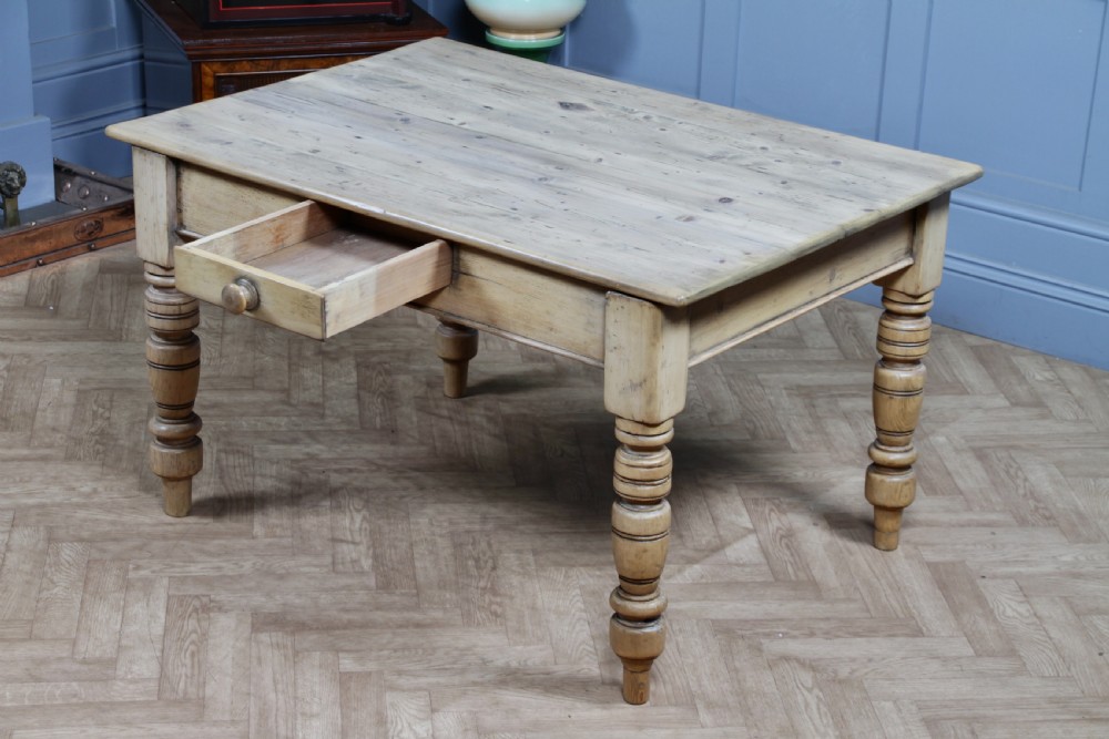A restored Victorian pine kitchen table featuring a scrubbed rectangular plank top, a single frieze drawer with a wooden knob, and four turned legs. View XXIII