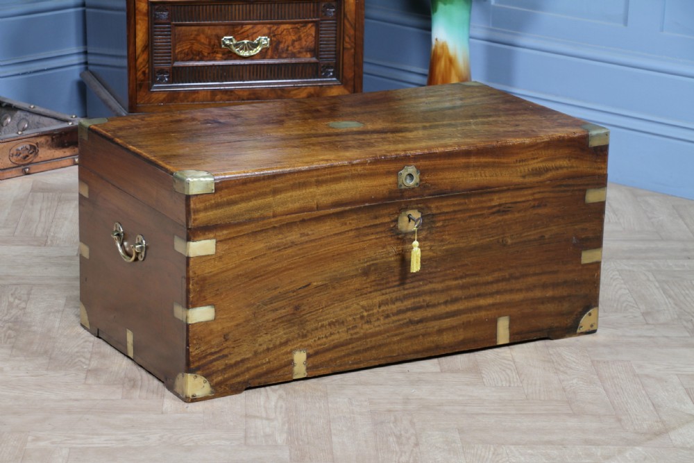A rectangular Victorian camphor wood military campaign trunk featuring brass corner straps, side handles, and a central brass keyhole. View III