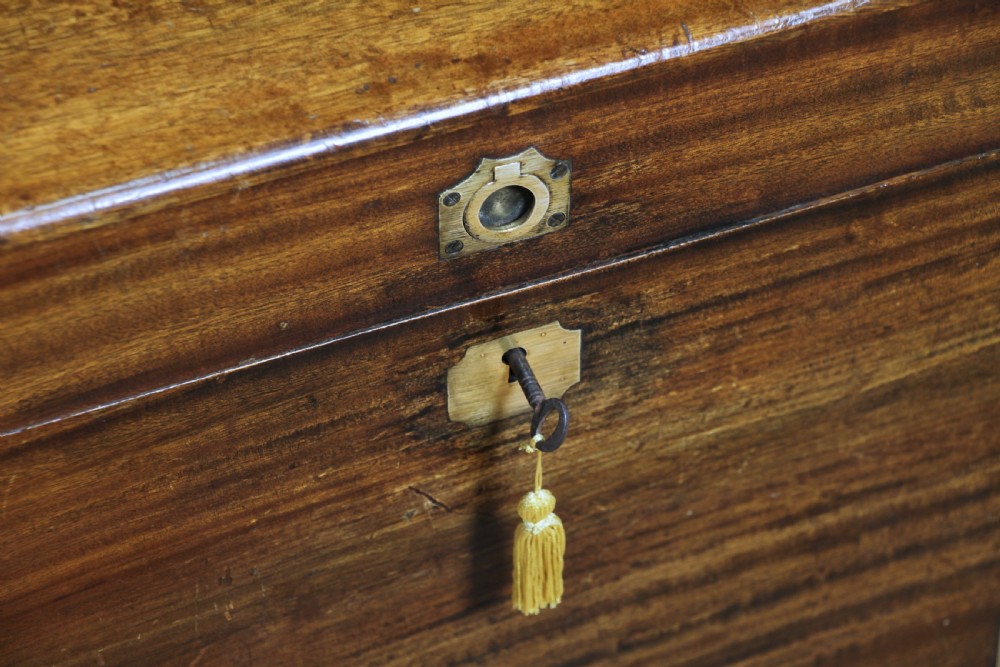A rectangular Victorian camphor wood military campaign trunk featuring brass corner straps, side handles, and a central brass keyhole. View XI