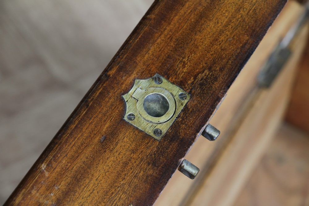 A rectangular Victorian camphor wood military campaign trunk featuring brass corner straps, side handles, and a central brass keyhole. View XII