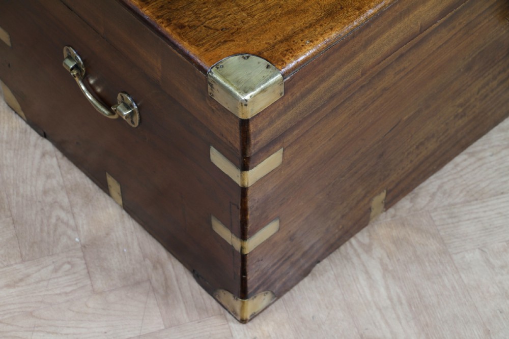 A rectangular Victorian camphor wood military campaign trunk featuring brass corner straps, side handles, and a central brass keyhole. View XIV