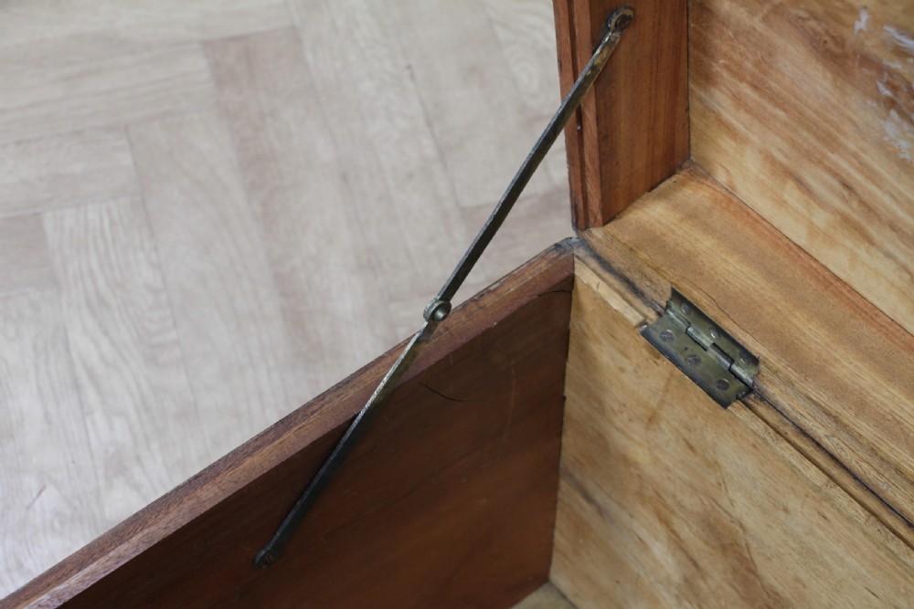 A rectangular Victorian camphor wood military campaign trunk featuring brass corner straps, side handles, and a central brass keyhole. View XVI