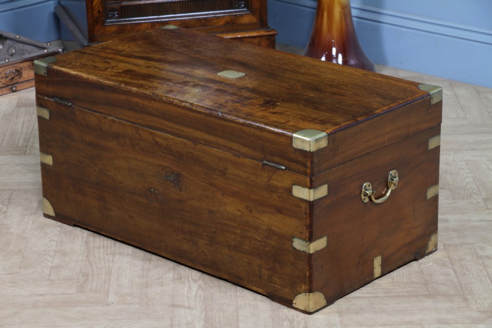 A rectangular Victorian camphor wood military campaign trunk featuring brass corner straps, side handles, and a central brass keyhole. View XIX