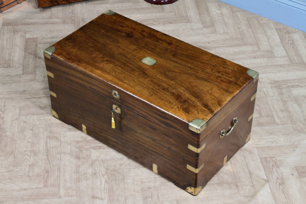 A rectangular Victorian camphor wood military campaign trunk featuring brass corner straps, side handles, and a central brass keyhole. View XXII
