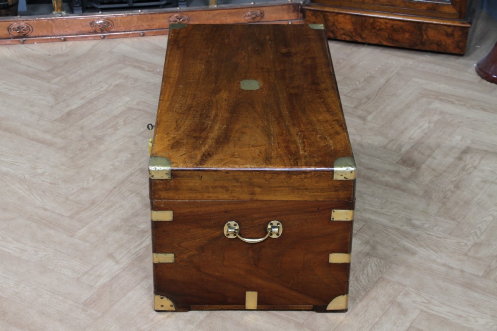 A rectangular Victorian camphor wood military campaign trunk featuring brass corner straps, side handles, and a central brass keyhole. View XXIII