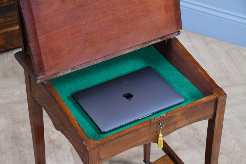 A late Victorian inlaid rosewood bonheur du jour writing desk featuring a green leather surface, raised gallery shelf, and tapered legs with brass castors. View XIII