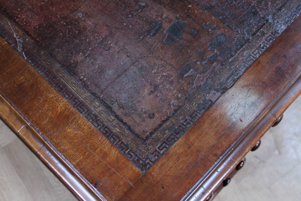 A Victorian mahogany pedestal desk featuring twin drawer pedestals, a dark leather writing inset, and a matching angled writing slope. View VIII