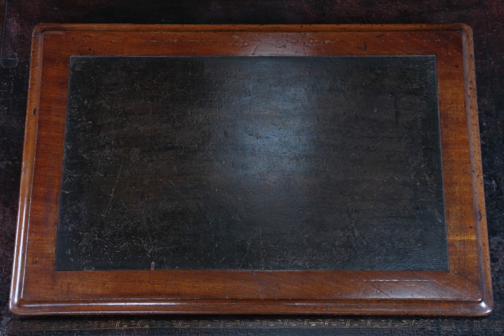 A Victorian mahogany pedestal desk featuring twin drawer pedestals, a dark leather writing inset, and a matching angled writing slope. View XII