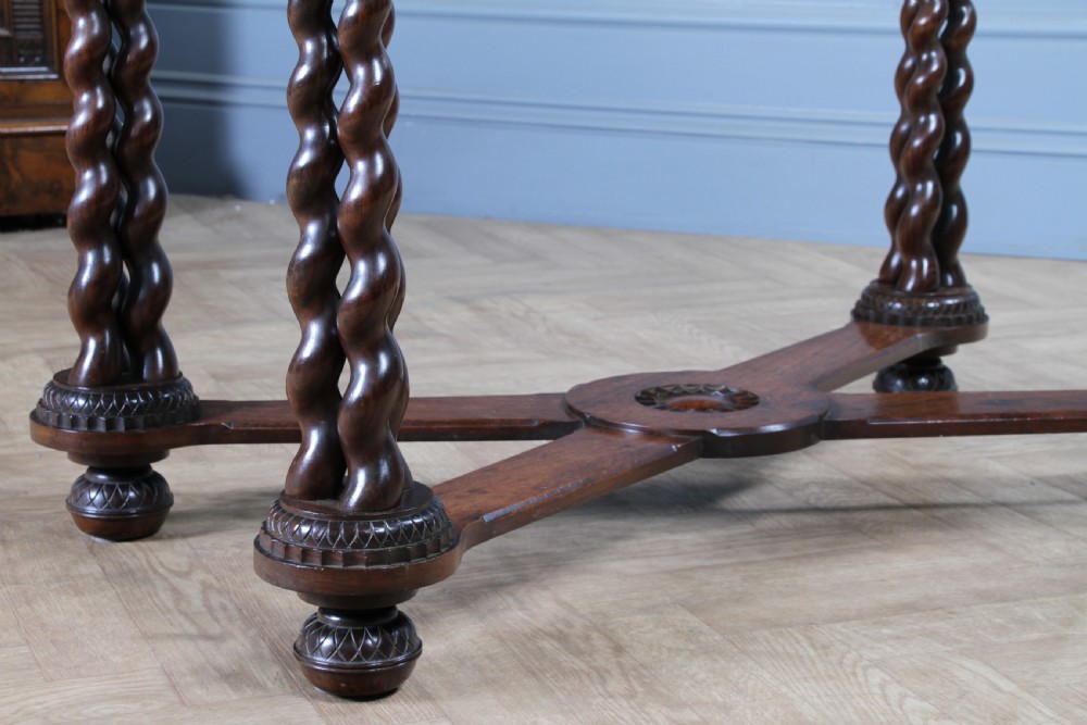Victorian dark rosewood hall table featuring four triple barley twist legs connected by a central X-frame stretcher. View VI
