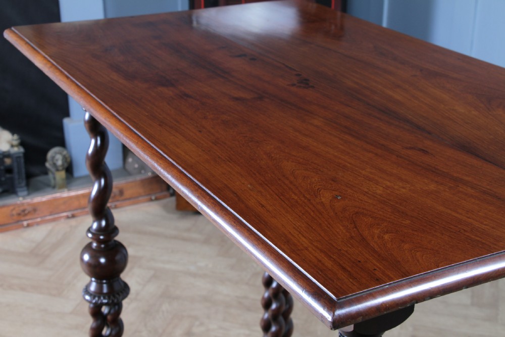 Victorian dark rosewood hall table featuring four triple barley twist legs connected by a central X-frame stretcher. View XV