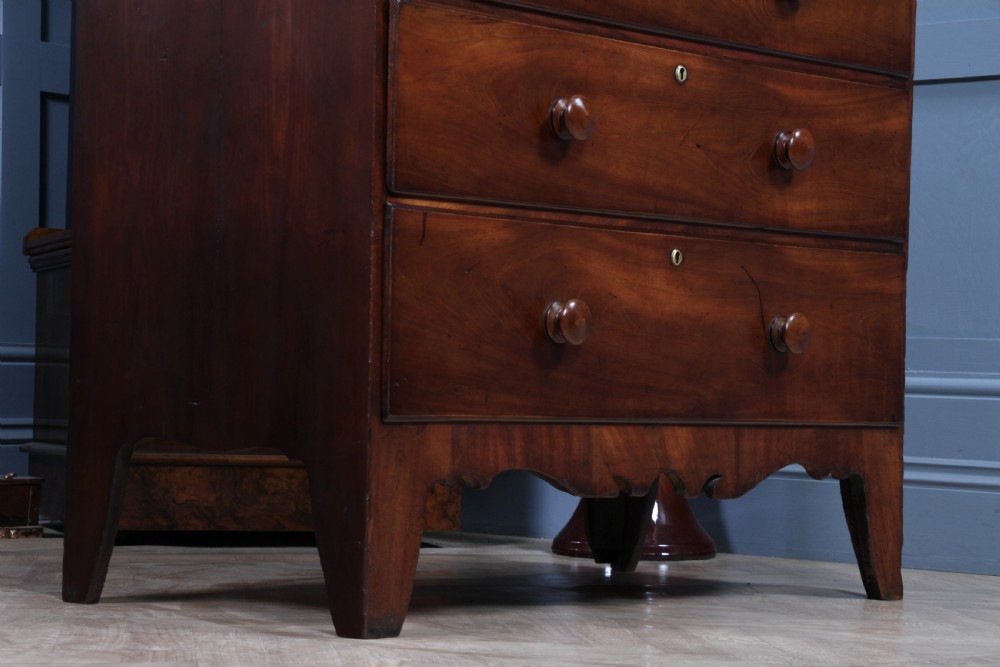 A Georgian Scottish mahogany chest on chest featuring eight drawers with turned wooden knobs, fluted side columns, and an overhanging pediment cornice. View X