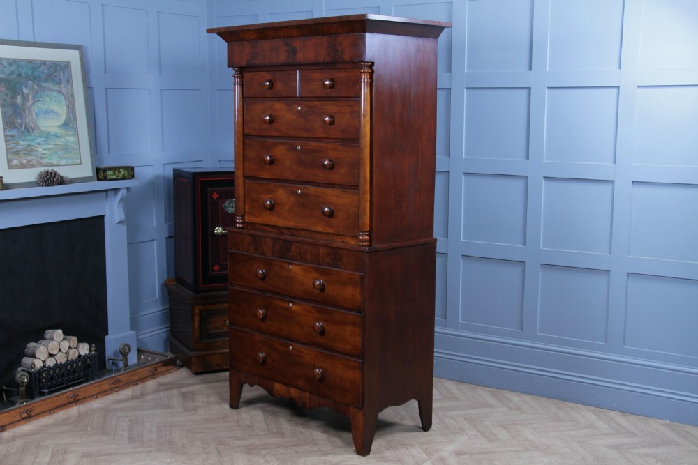A Georgian Scottish mahogany chest on chest featuring eight drawers with turned wooden knobs, fluted side columns, and an overhanging pediment cornice. View XIII